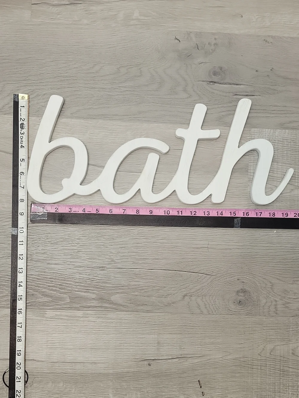 White cursive BATH wooden wall decor sign